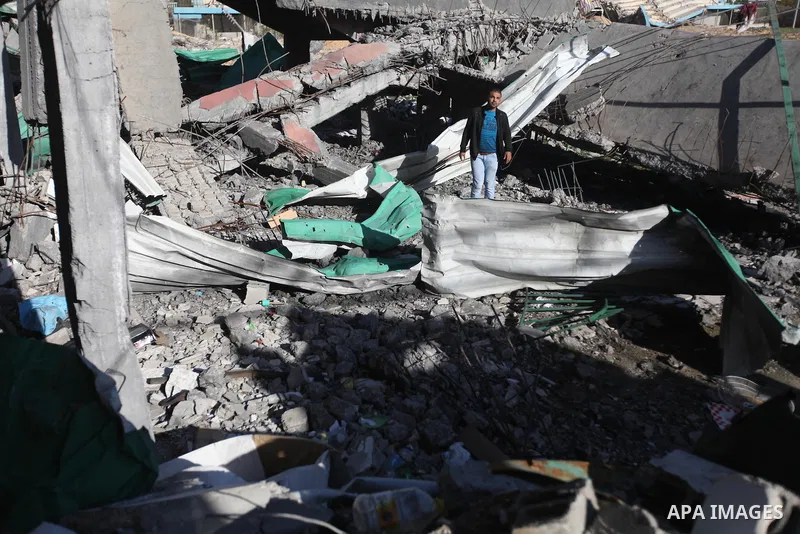 A Palestinian man inspects the damage in Palestine football playground which was destroyed in an Israeli air strike during the recently eight-day conflict with Hamas,in Gaza city on 13 January 2013. The Egyptian minister...