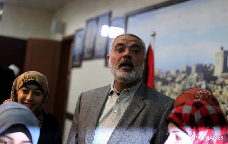 Palestinian Prime Minister Ismail Haniyeh meets with the sons of victims in the Israeli air strikes during the recently eight-day conflict with Hamas, in Gaza city on 15 January 2013. The sons of Palestinian victims rece...