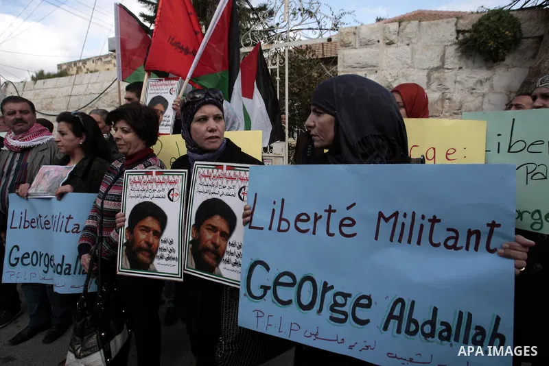 Palestinian supporters of the Popular Front for the Liberation of Palestine (PFLP) take part in a protest outside the French Cultural Center calling for the release of Lebanese militant Georges Ibrahim Abdallah and Ahmed...