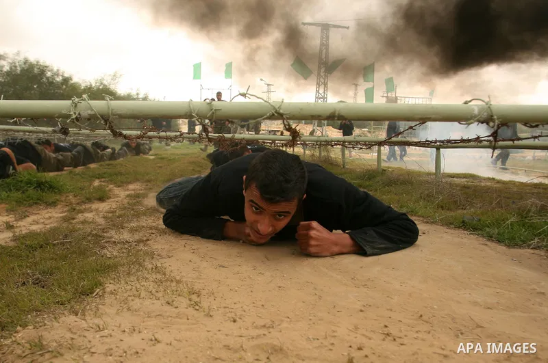 Palestinian youths display their skills during scouts training in Rafah southern Gaza strip, on January 23, 2013. Palestinian ministry of education and higher education organized a camp to train Palestinian boy scouts fo...