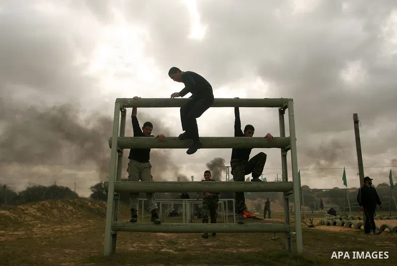 Palestinian youths display their skills during scouts training in Rafah southern Gaza strip, on January 23, 2013. Palestinian ministry of education and higher education organized a camp to train Palestinian boy scouts fo...