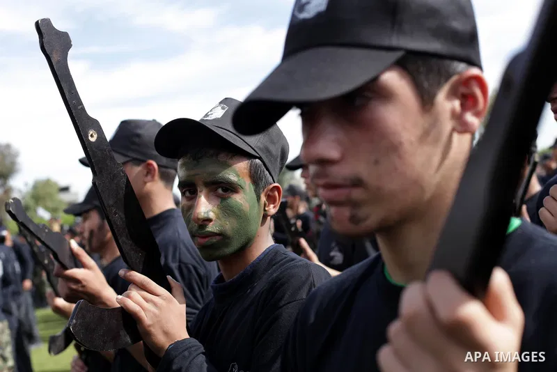 Palestinian youths display their skills during scouts training in Gaza city, on January 24, 2013. Palestinian ministry of education and higher education organized a camp to train Palestinian boy scouts for discipline, ar...