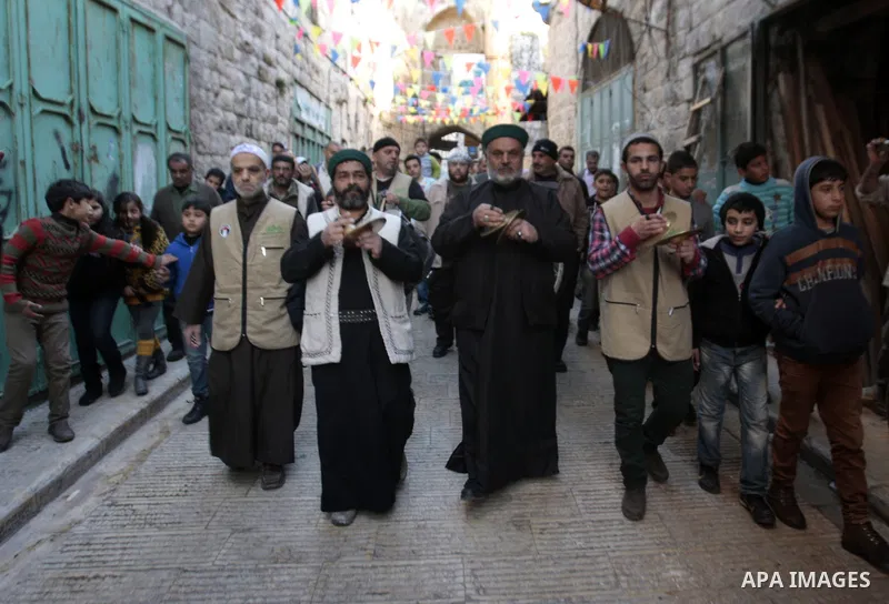 Palestinians Muslim Sufis play musical instruments as they parade through the streets during a ceremony commemorating the birth of Prophet Mohammed, known in Arabic as "Mawlid al-Nabawi", in the West Bank city of Nablus...
