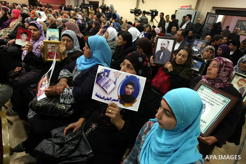 Palestinians participate the popular conference meeting to support Palestinian prisoners in the Israeli jails, in the Red Crescent headquarter in the West Bank city of Ramallah on January 28, 2013. Photo by Issam Rimawi
