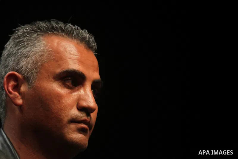 Palestinian director, Emad Burnat speaks before showing his film "5 Broken Cameras" in the West Bank city of Ramallah on January 29, 2013. The film 5 Broken Cameras was nominated for the 2013 Best Documentary Feature Osc...