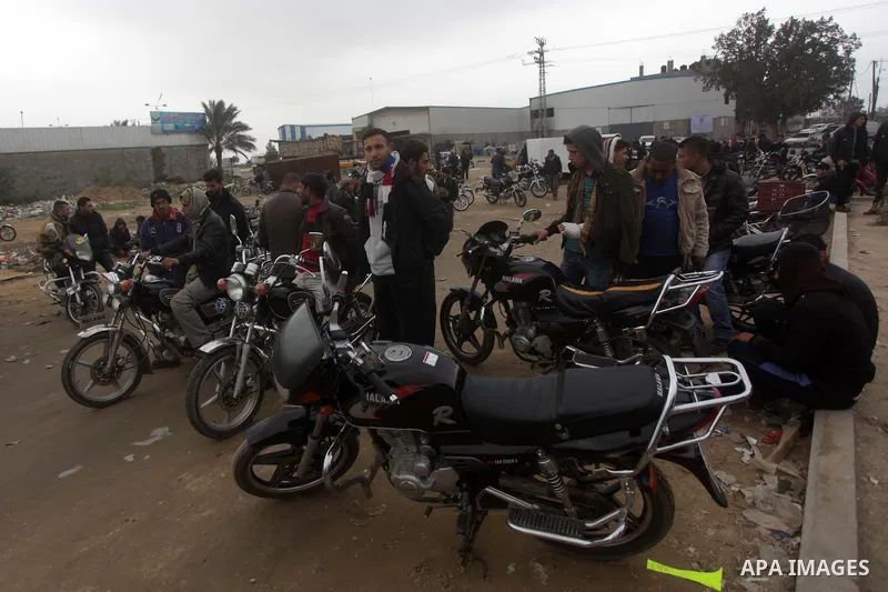 Palestinian men within the motorcycle market in Gaza city on Jan. 29 ,2013 . In this market, vendors display their motorcycle's to sell them for the buyers , as hundreds of Palestinians spend their free time in the south...