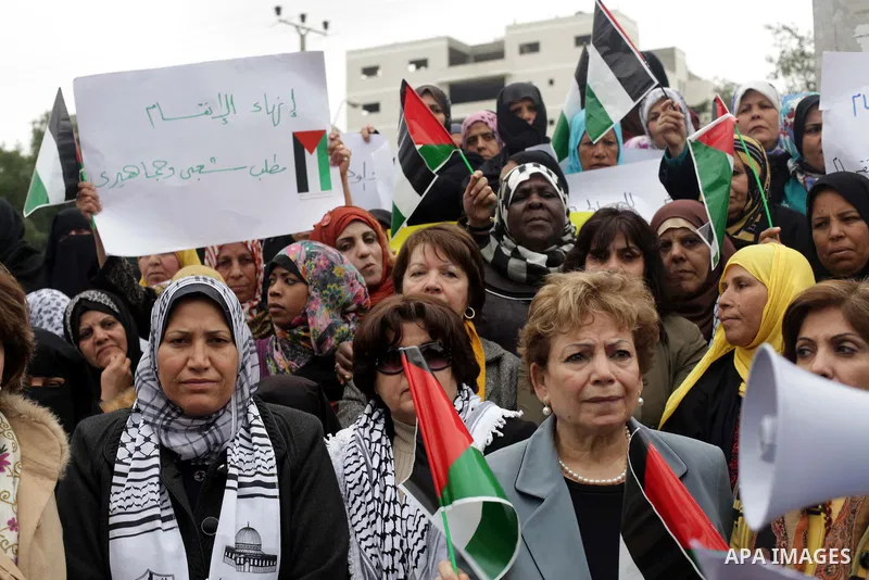 Palestinian women gather for a demonstration calling for the end of the political division between the Gaza Strip Hamas-led leadership and the Palestinian Authority Fatah-led in the West Bank city of Ramallah, on January...