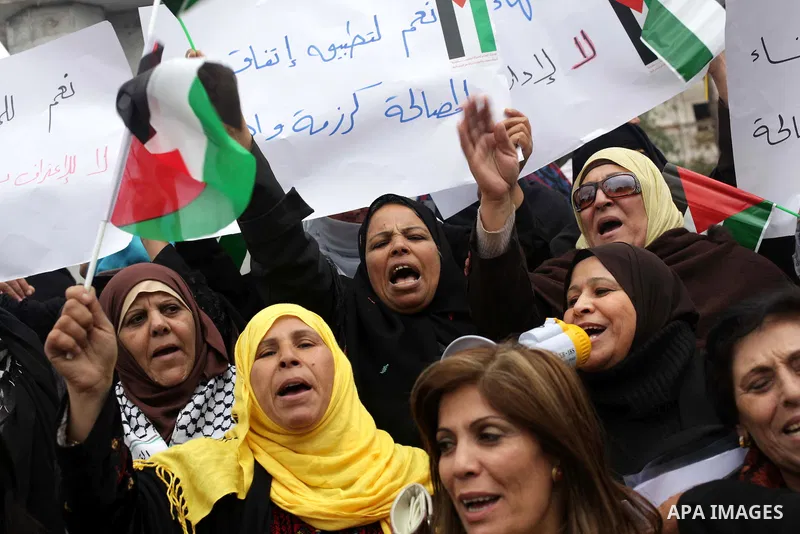 Palestinian women gather for a demonstration calling for the end of the political division between the Gaza Strip Hamas-led leadership and the Palestinian Authority Fatah-led in the West Bank city of Ramallah, on January...