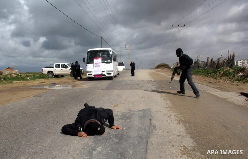 Palestinian policemen participate in practical exercises during a training course for the work safety in covering the wars, in Gaza city on Jan. 31, 2013. Many journalists participate in the first of its kind course in G...