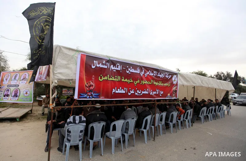 Palestinians gather in a sit-in tent near the Eriz crossing during a protest in solidarity with hunger-striking Palestinian prisoners held by Israel, demanding their releas northen Gaza strip on Feb. 05, 2013. Photo by M...