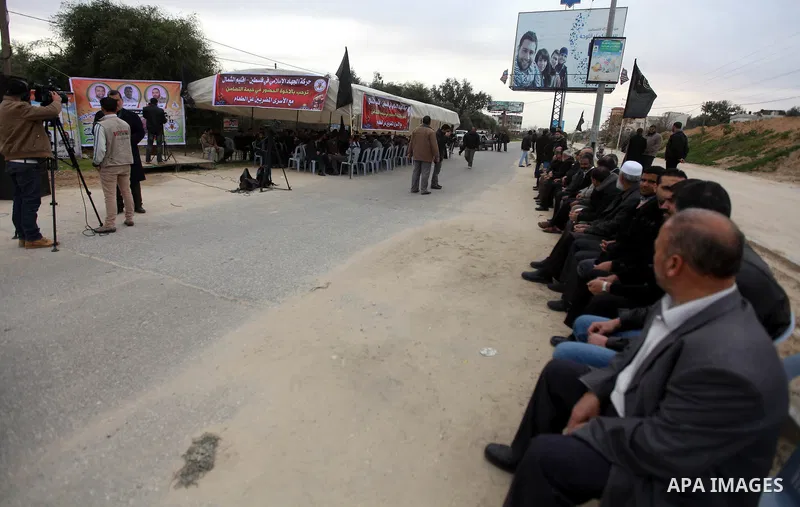 Palestinians gather in a sit-in tent near the Eriz crossing during a protest in solidarity with hunger-striking Palestinian prisoners held by Israel, demanding their releas northen Gaza strip on Feb. 05, 2013. Photo by M...