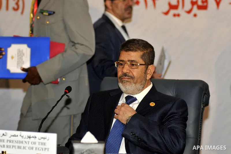 Egyptian President Mohammed Morsi (C) attends the 12th summit of the Organisation of Islamic Cooperation on February 6, 2013 in Cairo. The 12th summit of the Organisation of Islamic Cooperation opened in Cairo, with Syri...