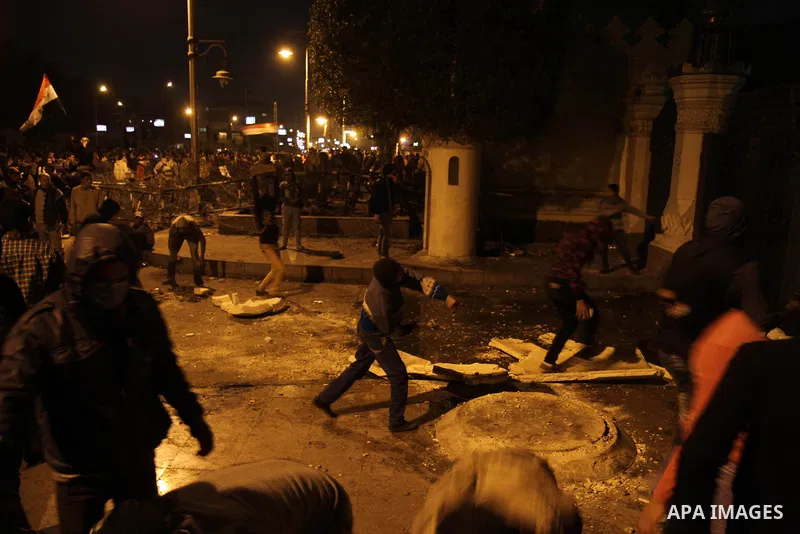 Egyptian anti-regime protesters set fire to the gate of the presidential palace during a demonstration in Cairo on February 8, 2013. Egyptian police fired tear gas at protesters who lobbed petrol bombs and set off firewo...