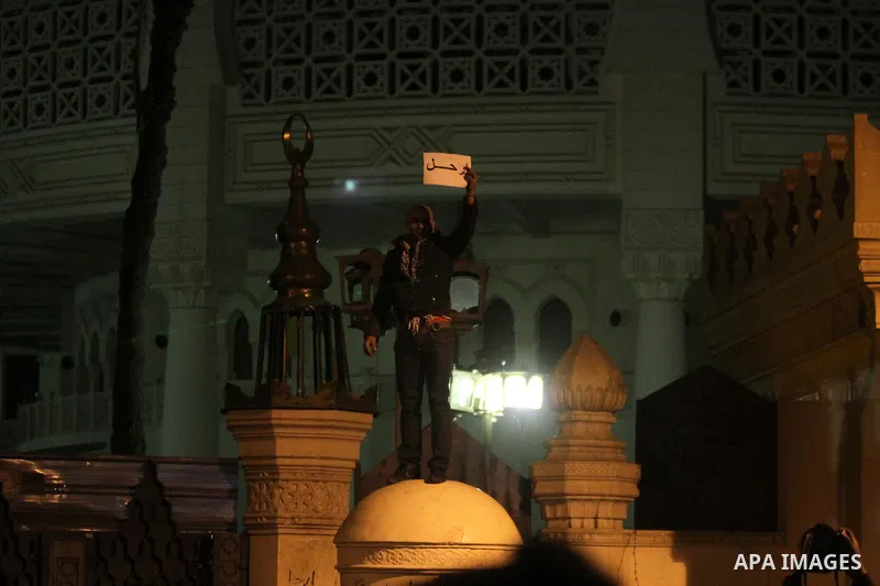 Egyptian anti-regime protesters set fire to the gate of the presidential palace during a demonstration in Cairo on February 8, 2013. Egyptian police fired tear gas at protesters who lobbed petrol bombs and set off firewo...