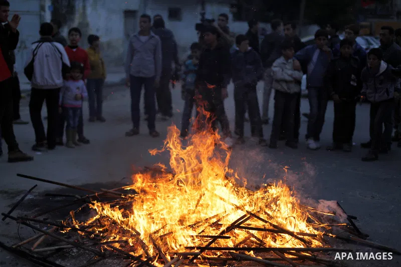 Palestinian supporters of Palestinian People's Party burn a symbolic jail during a demonstration in solidarity with hunger-striking Palestinian prisoners held by Israel, demanding their release in Gaza city on Feb, 10, 2...