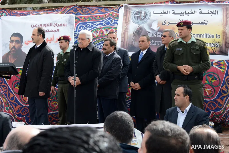 Palestinian President Mahmoud Abbas participates in a sit-in tent in solidarity with Palestinian prisoners in Israeli jails in the West Bank city of Ramallah, on February 15, 2013. A United Nations official on February 1...