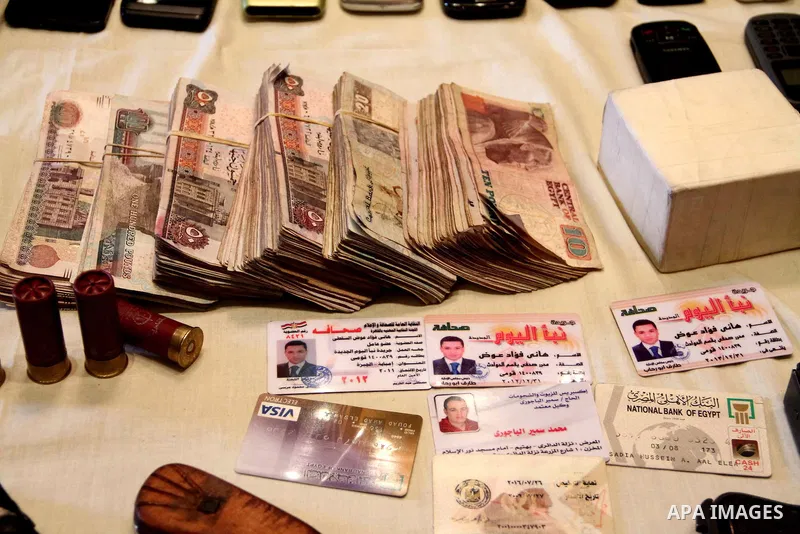 Egyptian Ministry of Interior officials attend a media conference to announce the arrest of the armed attackers on the car of Egypt Central Bank's chief governor in Cairo on 19 February 2013. Masked gunmen attacked the c...