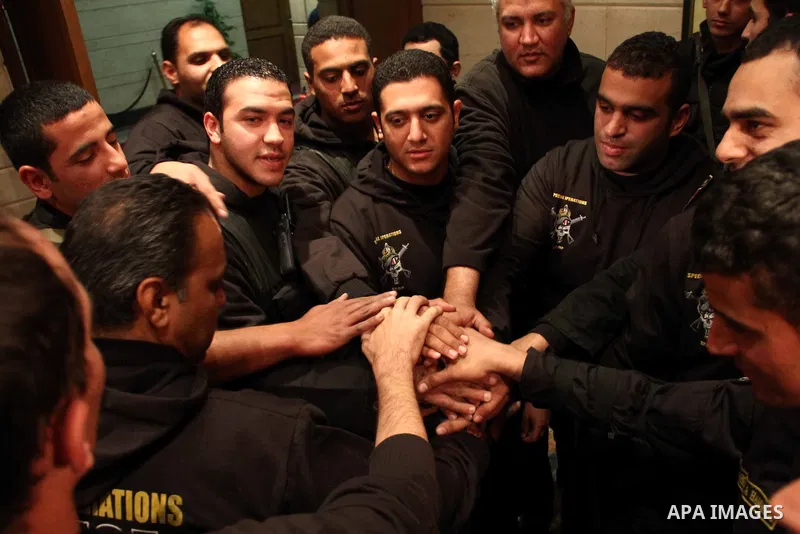 Egyptian Ministry of Interior officials attend a media conference to announce the arrest of the armed attackers on the car of Egypt Central Bank's chief governor in Cairo on 19 February 2013. Masked gunmen attacked the c...