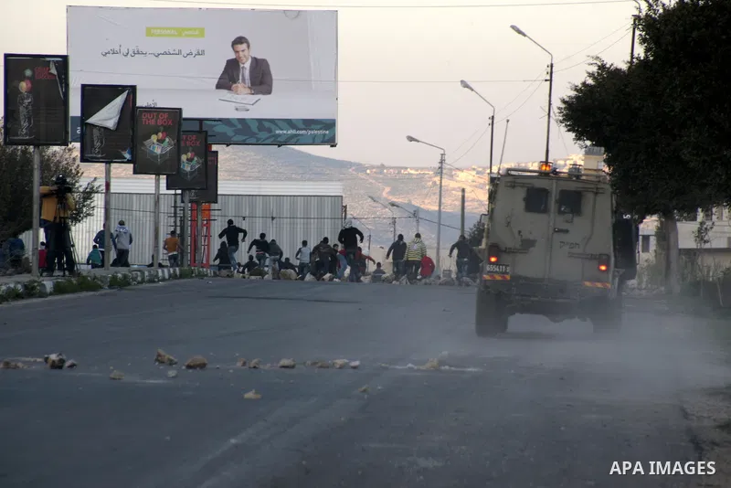 Palestinian demonstrators throw stones at Israeli border police during clashes at Huwwara checkpoint near Nablus, the West Bank, 21 February 2013. According to Palestinian sources, 12 Palestinians were injured during the...