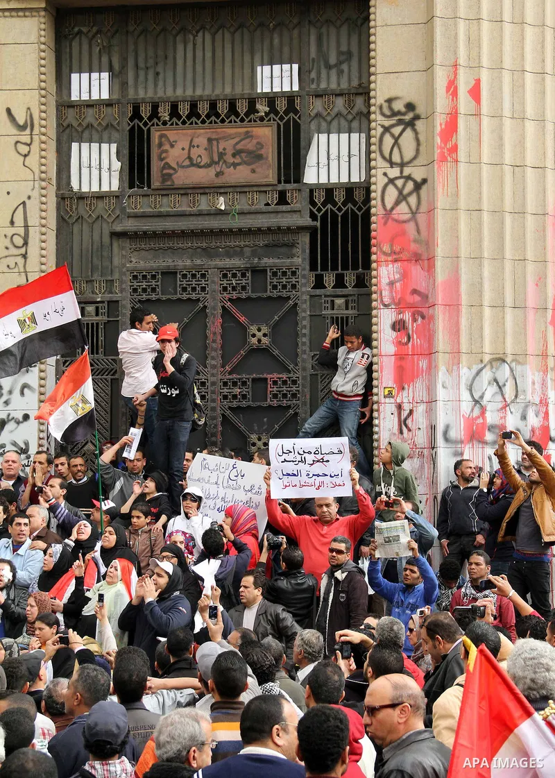 Egyptian protesters shout slogans during an anti-government demonstration against the government of President Morsi, in front of High Court, in Cairo, Egypt, 22 February 2013. The opposition accuses Morsi, Egypt's first...