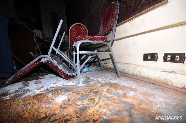 A picture shows the charred remains of Egyptian laywer Ayman Nur's office, chairman of the Ghad El-Thawra Party, after members of the Black Bloc group torched his office in downtown Cairo on February 22, 2013. Photo by T...