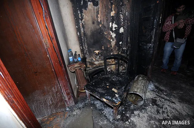 A picture shows the charred remains of Egyptian laywer Ayman Nur's office, chairman of the Ghad El-Thawra Party, after members of the Black Bloc group torched his office in downtown Cairo on February 22, 2013. Photo by T...