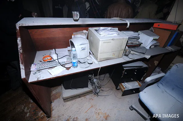 A picture shows the charred remains of Egyptian laywer Ayman Nur's office, chairman of the Ghad El-Thawra Party, after members of the Black Bloc group torched his office in downtown Cairo on February 22, 2013. Photo by T...