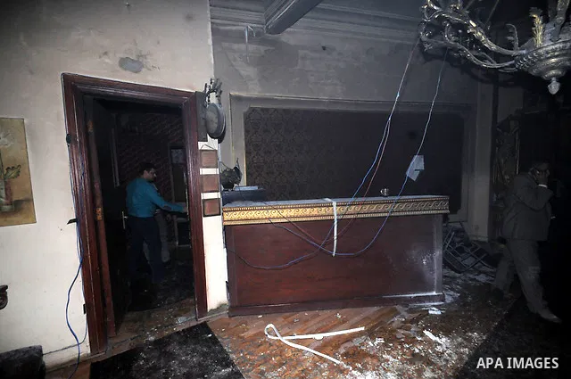 A picture shows the charred remains of Egyptian laywer Ayman Nur's office, chairman of the Ghad El-Thawra Party, after members of the Black Bloc group torched his office in downtown Cairo on February 22, 2013. Photo by T...
