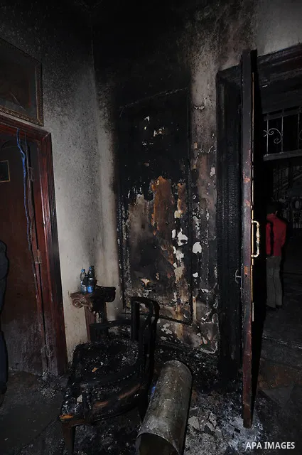 A picture shows the charred remains of Egyptian laywer Ayman Nur's office, chairman of the Ghad El-Thawra Party, after members of the Black Bloc group torched his office in downtown Cairo on February 22, 2013. Photo by T...