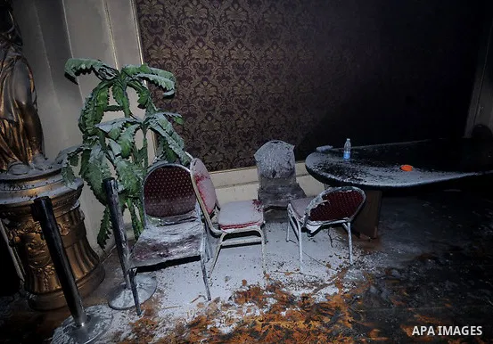 A picture shows the charred remains of Egyptian laywer Ayman Nur's office, chairman of the Ghad El-Thawra Party, after members of the Black Bloc group torched his office in downtown Cairo on February 22, 2013. Photo by T...