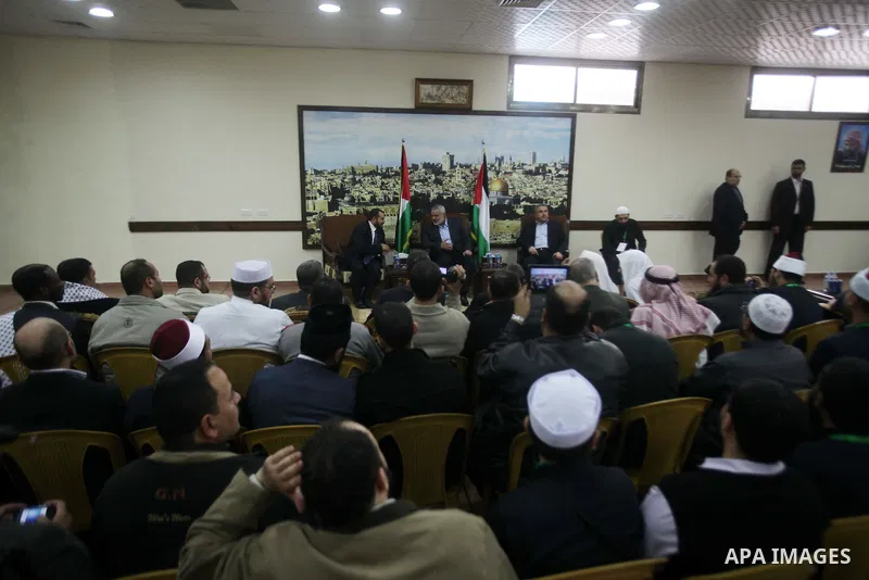 Palestinian Prime Minister in Gaza strip Ismail Haniyeh, receives preacher Salah Sultan, in Gaza city, on Feb. 23, 2013. Photo by Ashraf Amra