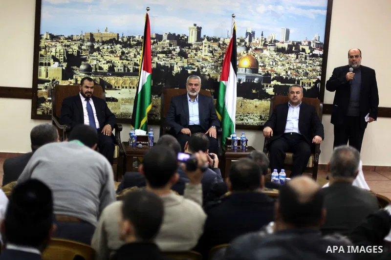 Palestinian Prime Minister in Gaza strip Ismail Haniyeh, receives preacher Salah Sultan, in Gaza city, on Feb. 23, 2013. Photo by Ashraf Amra