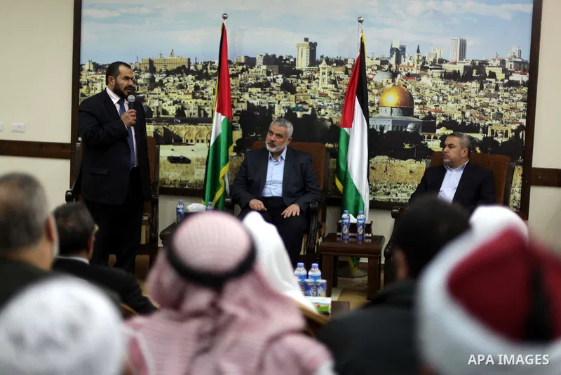 Palestinian Prime Minister in Gaza strip Ismail Haniyeh, receives preacher Salah Sultan, in Gaza city, on Feb. 23, 2013. Photo by Ashraf Amra