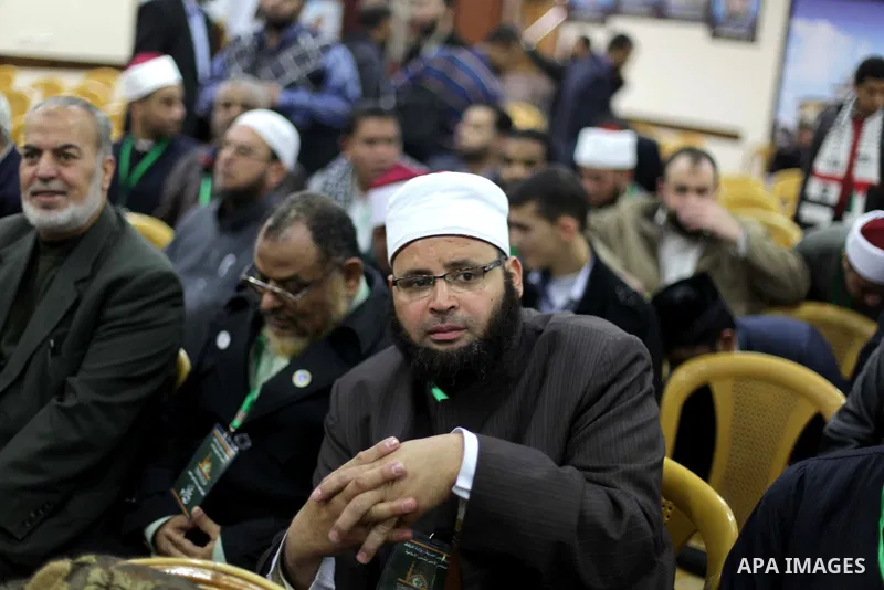 Palestinian Prime Minister in Gaza strip Ismail Haniyeh, (not seen) receives delegation of the preachers and Egyptian scientists, in Gaza city, on Feb. 23, 2013. Photo by Ashraf Amra