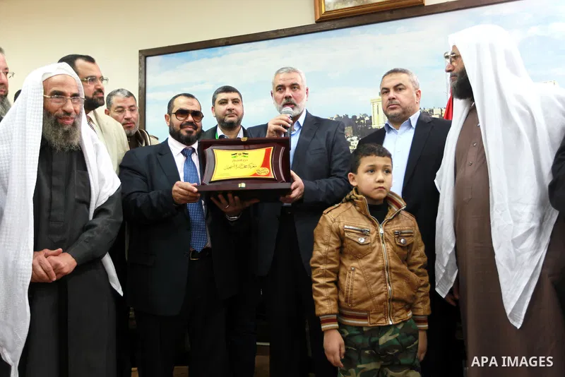 Palestinian Prime Minister in Gaza strip Ismail Haniyeh, receives delegation of the preachers and Egyptian scientists, in Gaza city, on Feb. 23, 2013. Photo by Ahmed Shaat