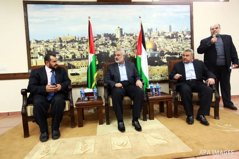 Palestinian Prime Minister in Gaza strip Ismail Haniyeh, receives preacher Salah Sultan, in Gaza city, on Feb. 23, 2013. Photo by Ahmed Shaat