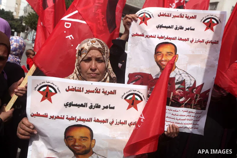 Supporters of the Palestinian Democratic Front protest in solidarity with Palestinian prisoners held in Israeli jails in Gaza city on Feb. 23, 2013. The demonstration was held in solidarity with Palestinian prisoner Same...