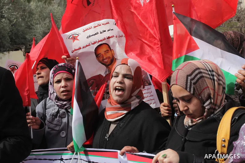 Supporters of the Palestinian Democratic Front protest in solidarity with Palestinian prisoners held in Israeli jails in Gaza city on Feb. 23, 2013. The demonstration was held in solidarity with Palestinian prisoner Same...