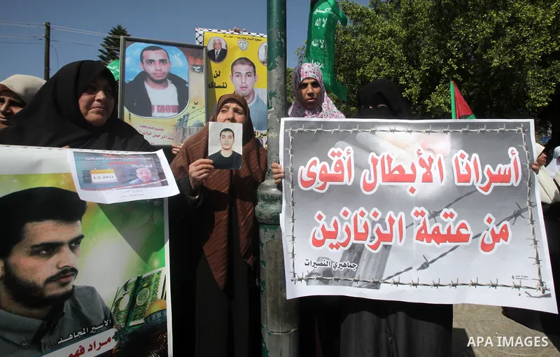 Palestinian women take part in a protest against the death of a Palestinian detainee in an Israeli jail, in Gaza City February 24, 2013. Palestinian officials on Saturday demanded an international investigation into the...