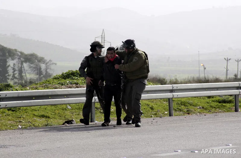 Israeli border police detain a Palestinian during clashes at Hawwara military checkpoint near the West Bank city of Nablus, on February 24, 2013 following the death of a Palestinian prisoner held in Israel. Some 3,000 Pa...