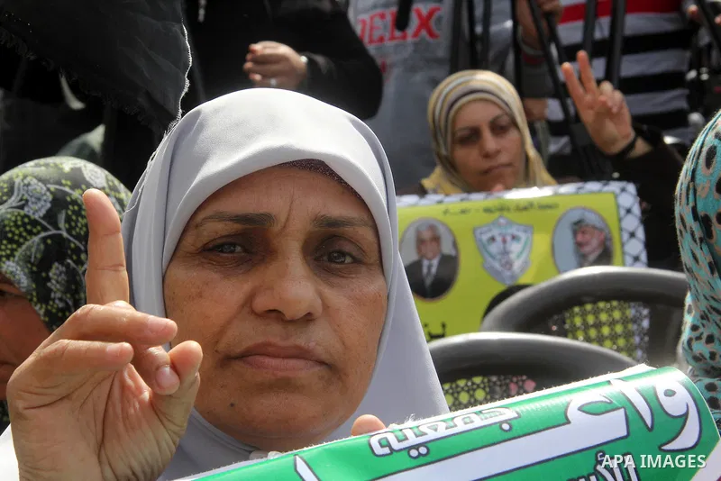 Palestinians take part in a protest against the death of a Palestinian detainee in an Israeli jail, in Gaza City February 25, 2013. Palestinian officials on Saturday demanded an international investigation into the death...