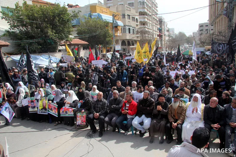 Palestinians take part in a protest against the death of a Palestinian detainee in an Israeli jail, in Gaza City February 25, 2013. Palestinian officials on Saturday demanded an international investigation into the death...