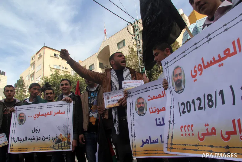 Palestinians take part in a protest against the death of a Palestinian detainee in an Israeli jail, in Gaza City February 25, 2013. Palestinian officials on Saturday demanded an international investigation into the death...