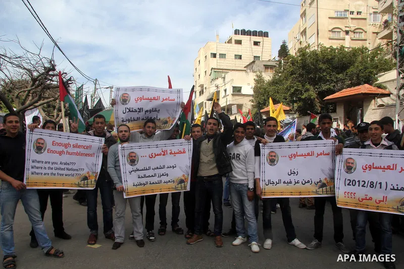Palestinians take part in a protest against the death of a Palestinian detainee in an Israeli jail, in Gaza City February 25, 2013. Palestinian officials on Saturday demanded an international investigation into the death...