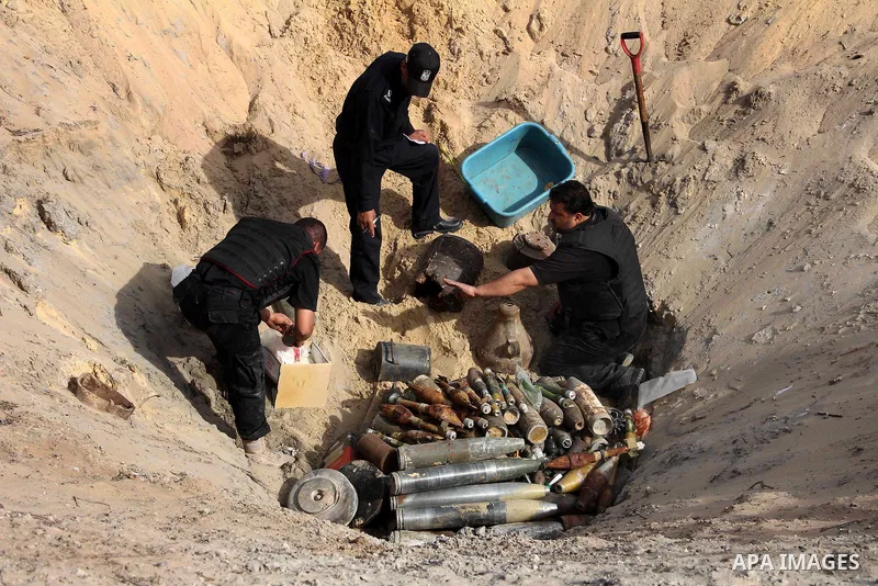Palestinian security forces prepare to neutralise unexploded ordnance left behind from last November's eight-day Israeli military offensive in the southern Gaza Strip town of Khan Yunis on February 25, 2013. United Natio...