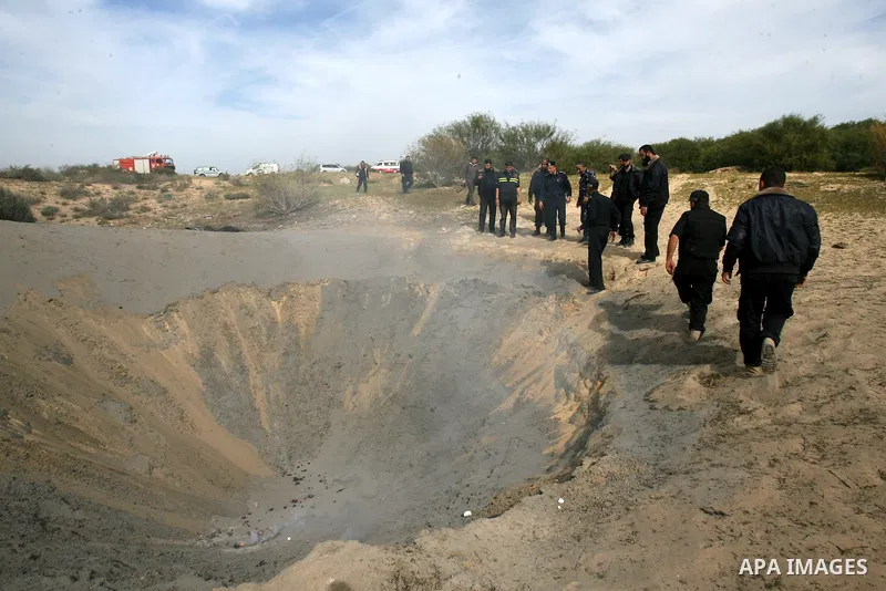 Palestinian security forces prepare to neutralise unexploded ordnance left behind from last November's eight-day Israeli military offensive in the southern Gaza Strip town of Khan Yunis on February 25, 2013. United Natio...