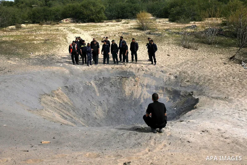 Palestinian security forces prepare to neutralise unexploded ordnance left behind from last November's eight-day Israeli military offensive in the southern Gaza Strip town of Khan Yunis on February 25, 2013. United Natio...