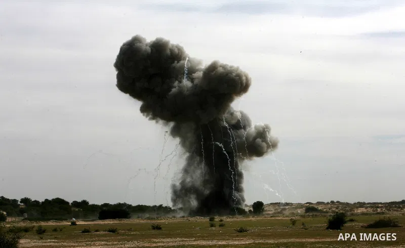 Smoke billows following an explosion in the southern Gaza Strip town of Khan Yunis on February 25, 2013 as Palestinian security forces work with United Nations explosives experts to detect and neutralise unexploded ordna...