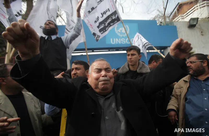 Palestinians take part in a protest against the death of a Palestinian detainee in an Israeli jail, in front of the headquarters of the United Nations in Gaza City February 25, 2013. Palestinian officials on Saturday dem...