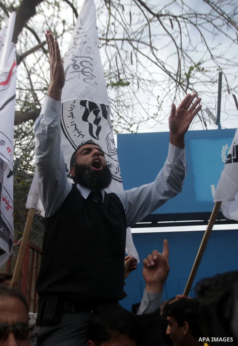 Palestinians take part in a protest against the death of a Palestinian detainee in an Israeli jail, in front of the headquarters of the United Nations in Gaza City February 25, 2013. Palestinian officials on Saturday dem...